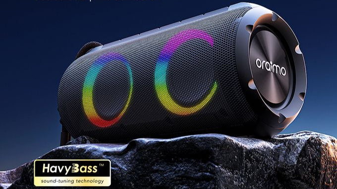 Bluetooth speaker with colorful lights on a dark background, featuring Oraimo branding.